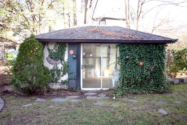 14 Woodleigh Road Dedham, MA 02026 - Photo 24 of 24 a view of a house with potted plants and large trees