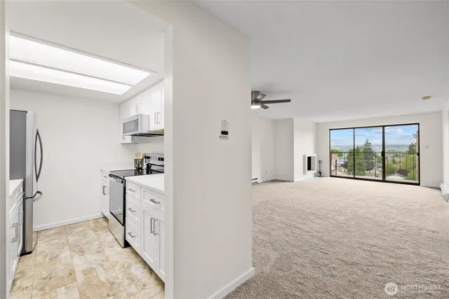 a view of an empty room with windows