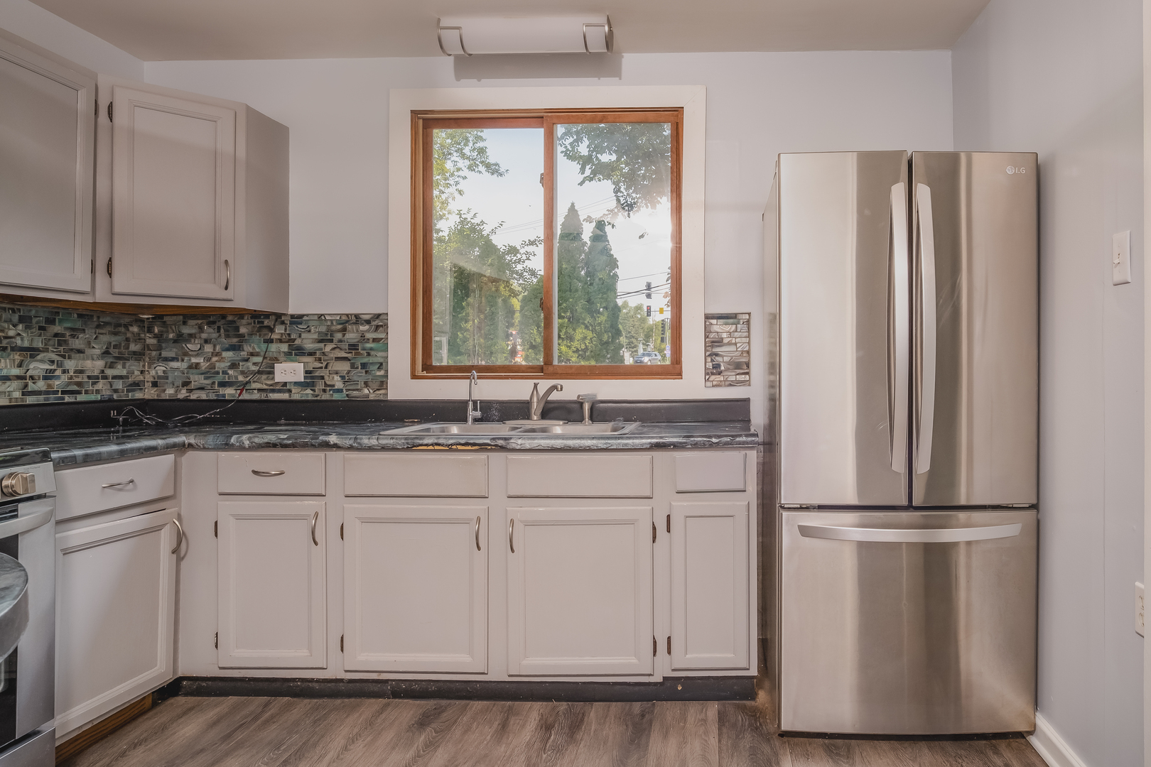 37902 North West Street Spring Grove, IL 60081 - Photo 13 of 26 a kitchen with appliances cabinets and a window