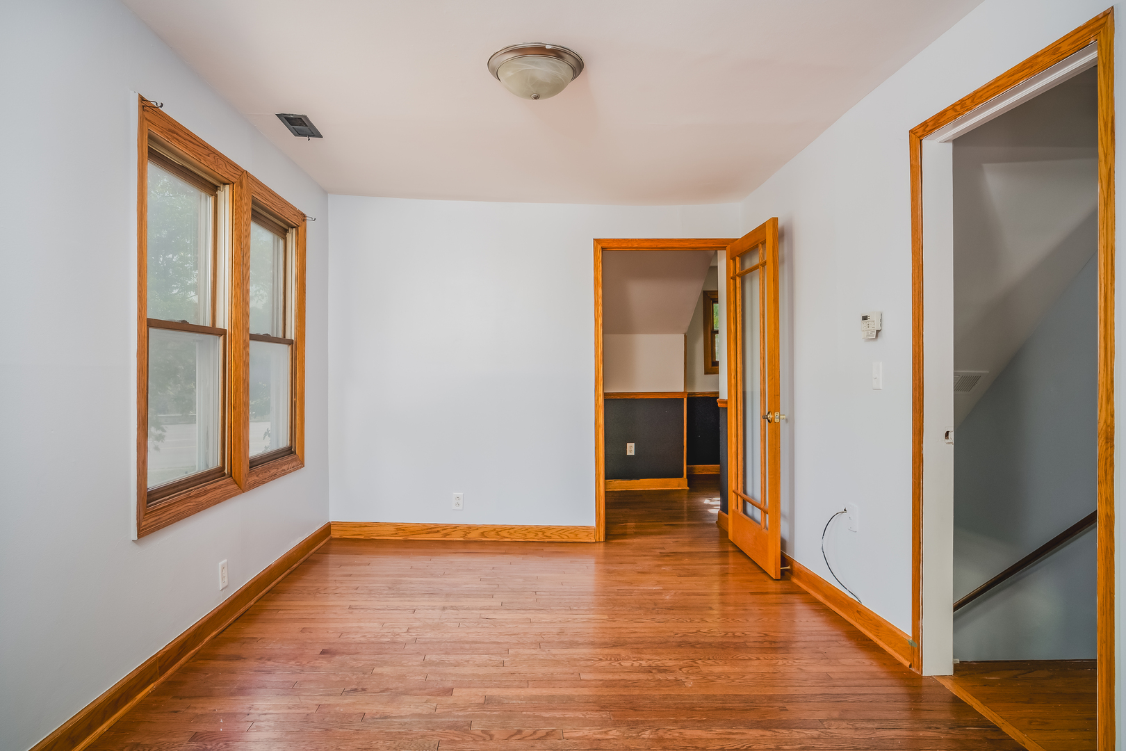 37902 North West Street Spring Grove, IL 60081 - Photo 19 of 26 a view of an empty room with window and wooden floor