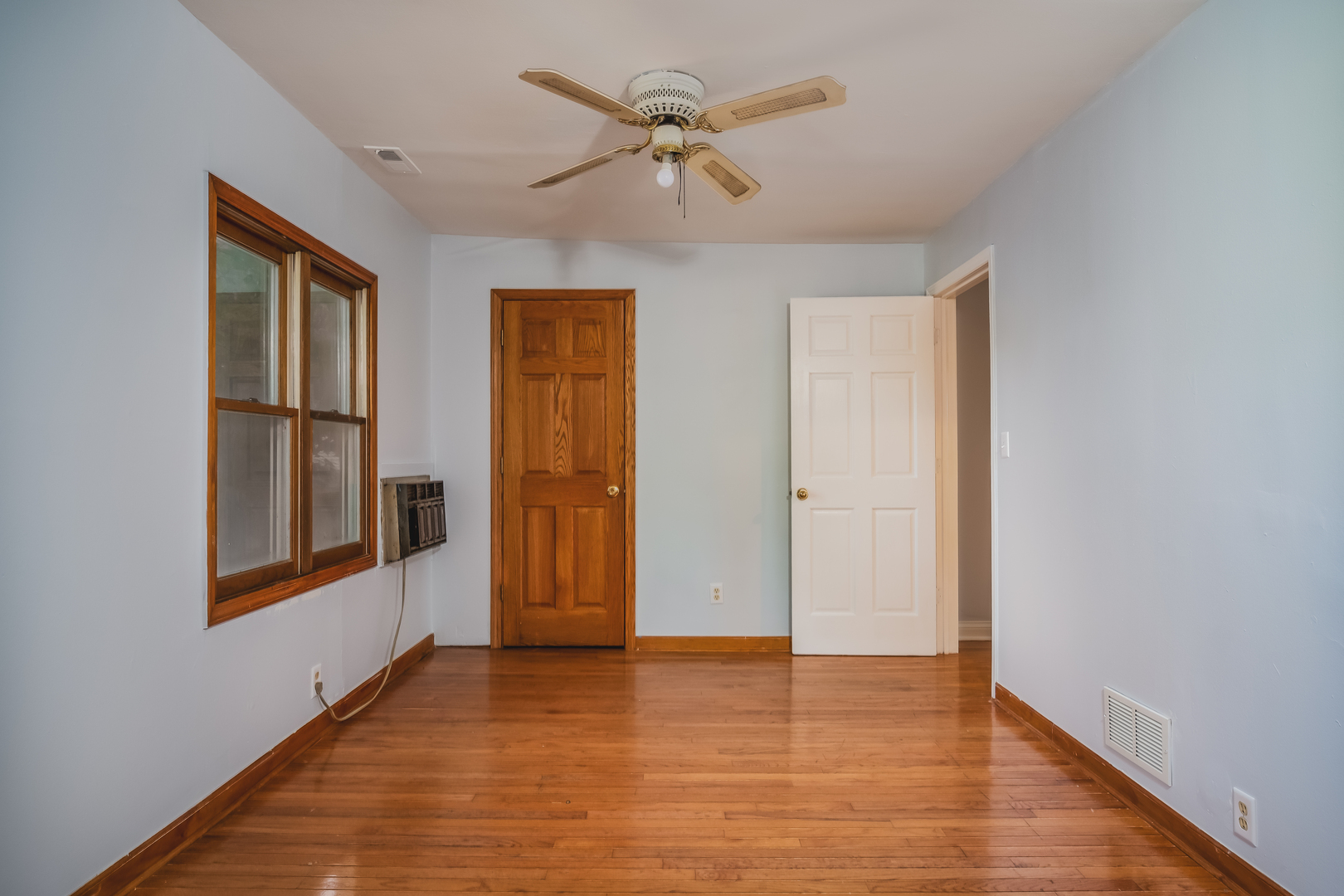 37902 North West Street Spring Grove, IL 60081 - Photo 25 of 26 a view of an empty room with window and wooden floor