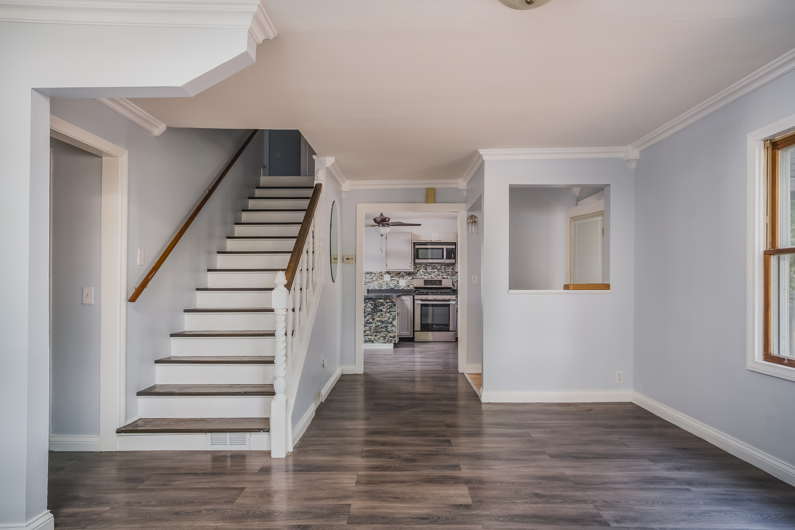 37902 North West Street Spring Grove, IL 60081 - Photo 7 of 26 a view of a room with wooden floor and stairs