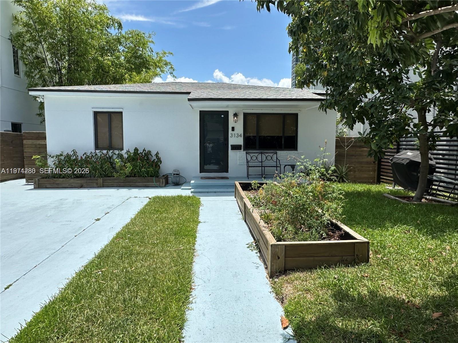 3134 Carter Street Miami, FL 33133 - Photo 1 of 36 front view of a house with a yard