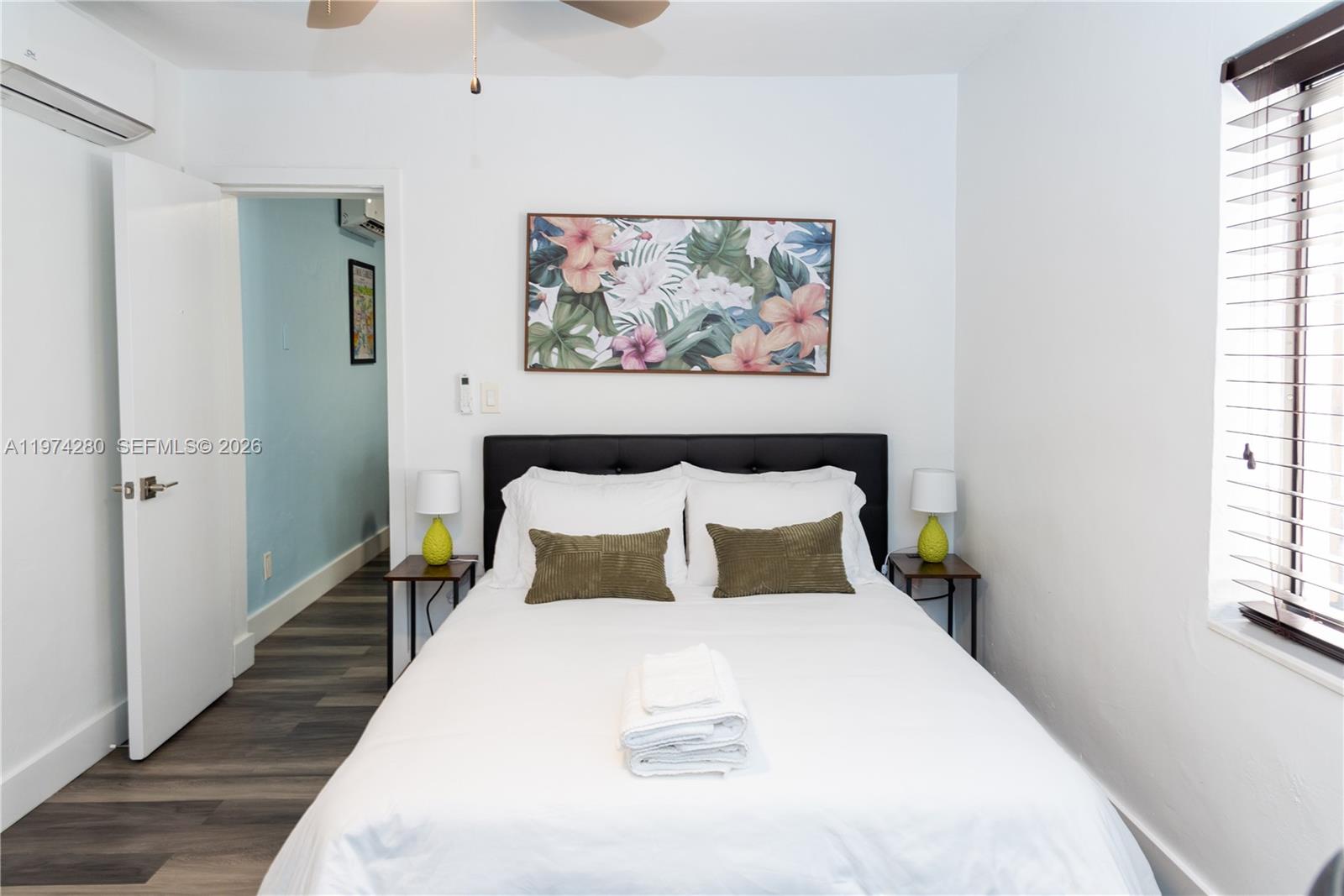 3134 Carter Street Miami, FL 33133 - Photo 12 of 36 a large bed in a bedroom next to a window