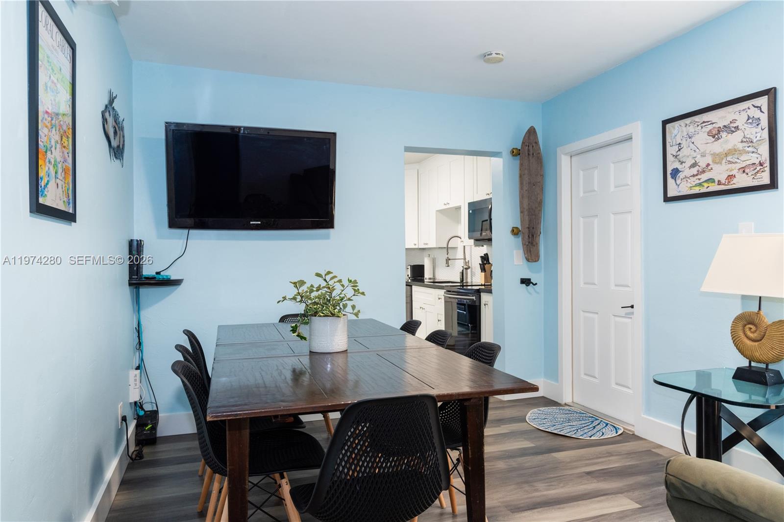 3134 Carter Street Miami, FL 33133 - Photo 13 of 36 a view of a dining room with furniture and wooden floor