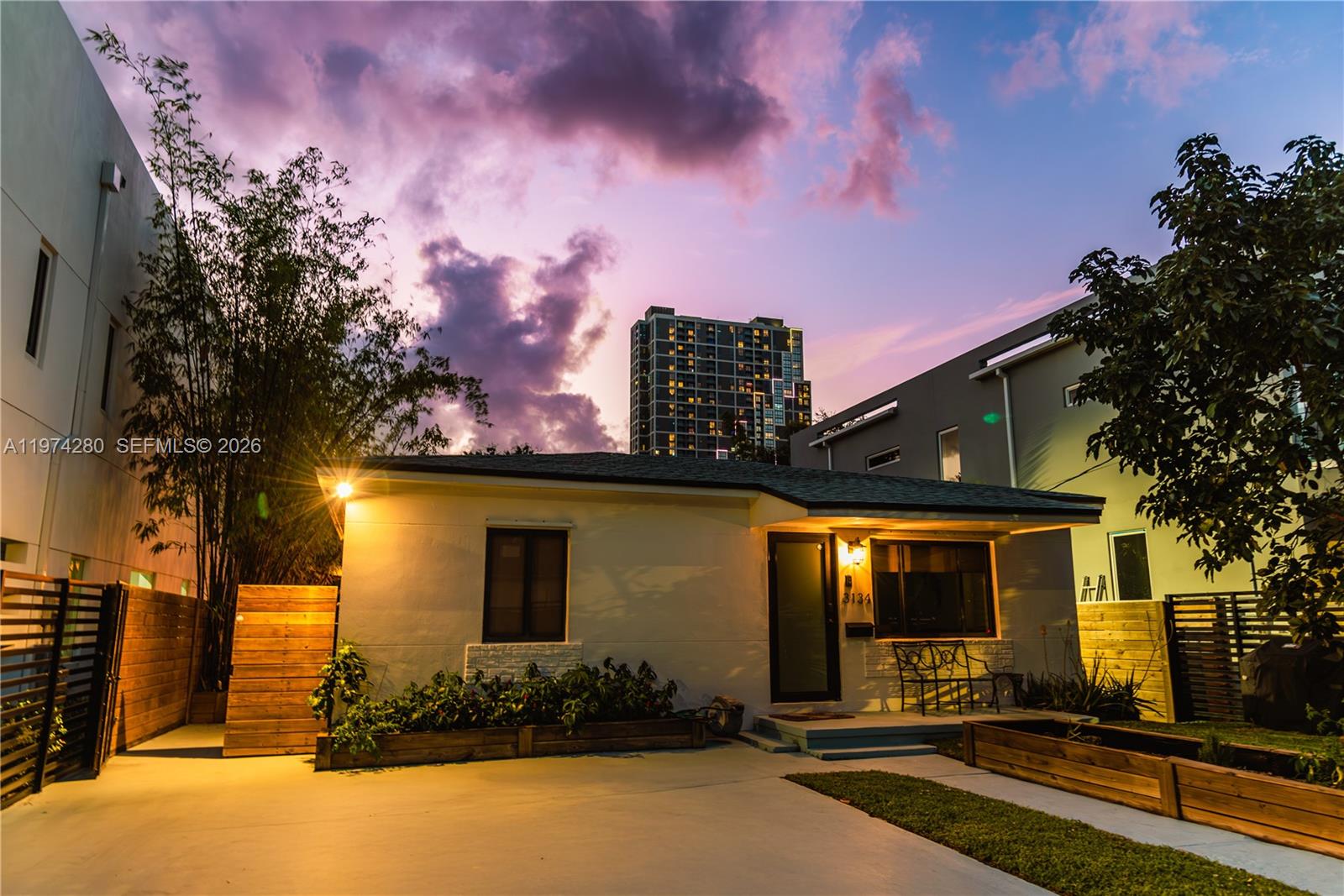 3134 Carter Street Miami, FL 33133 - Photo 14 of 36 a front view of a house with basket ball court and outdoor seating