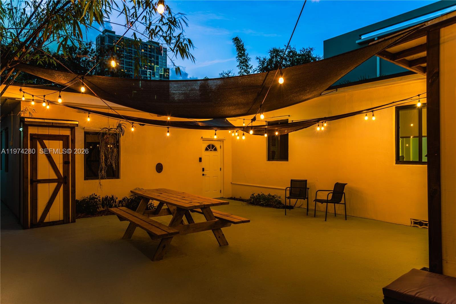 3134 Carter Street Miami, FL 33133 - Photo 15 of 36 a roof deck with table and chairs