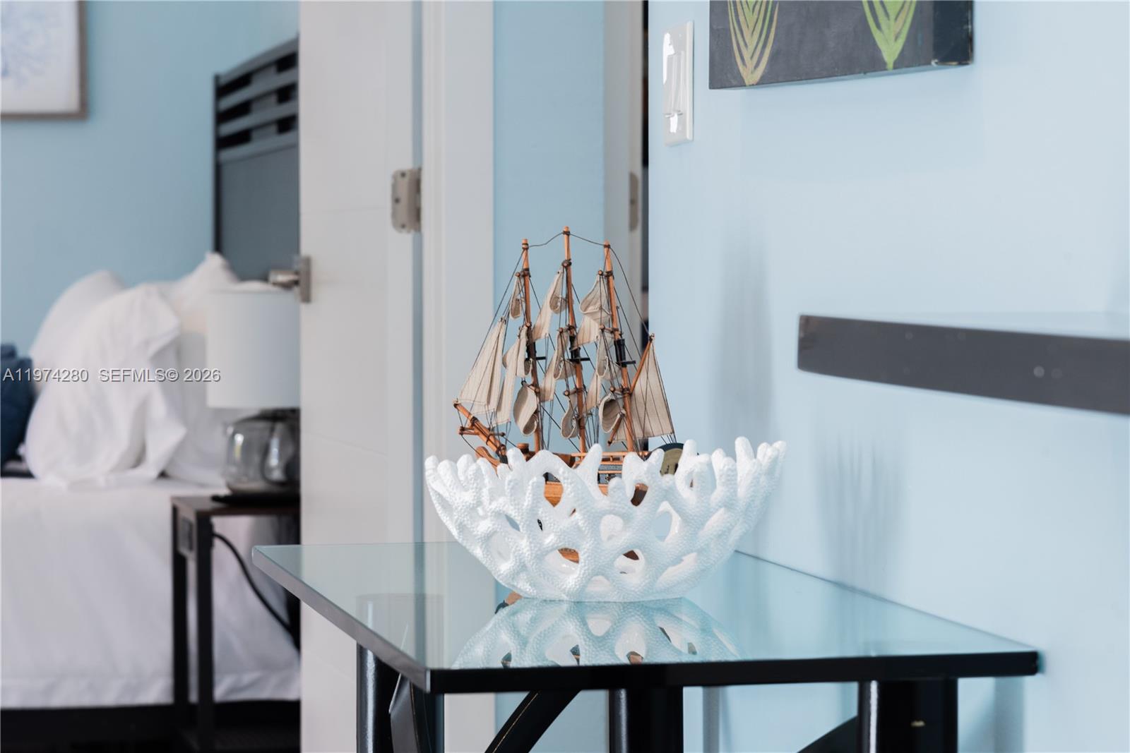 3134 Carter Street Miami, FL 33133 - Photo 20 of 36 a view of kitchen island with furniture and wooden floor