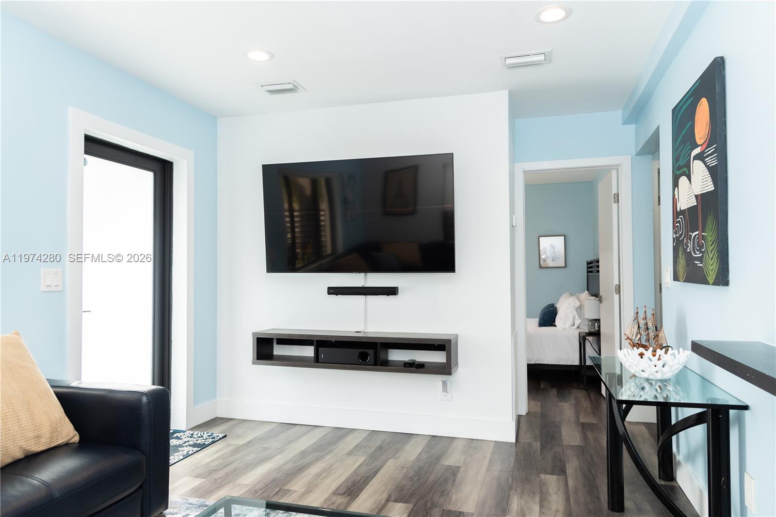 3134 Carter Street Miami, FL 33133 - Photo 21 of 36 a living room with furniture and a flat screen tv