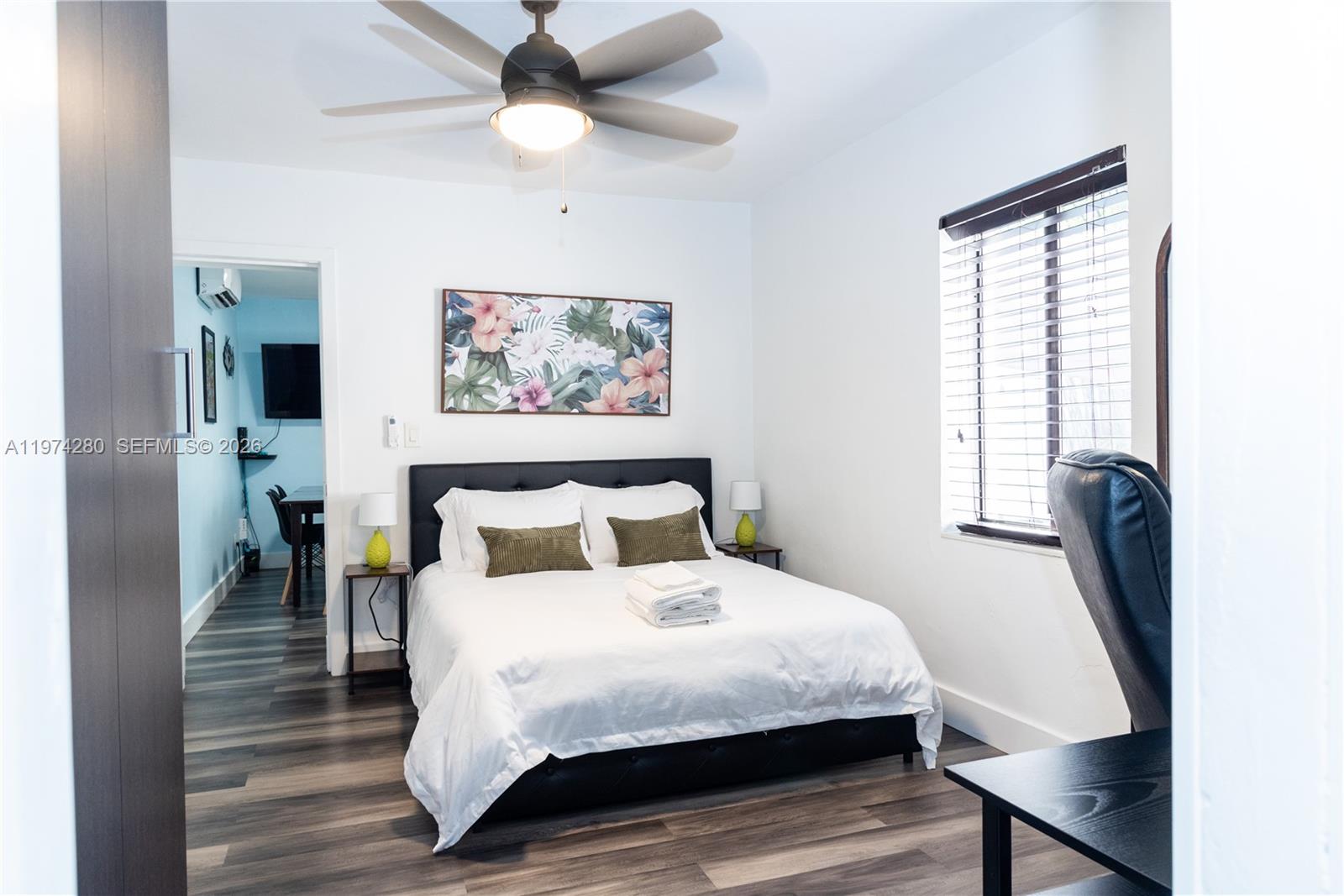 3134 Carter Street Miami, FL 33133 - Photo 22 of 36 a bedroom with a bed and a painting on the wall