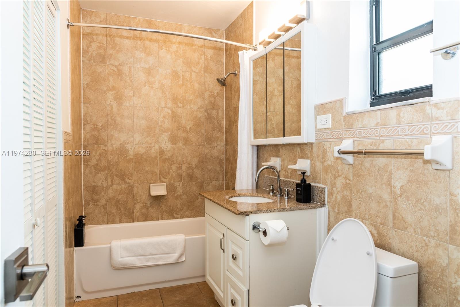 3134 Carter Street Miami, FL 33133 - Photo 23 of 36 a bathroom with a sink toilet and shower
