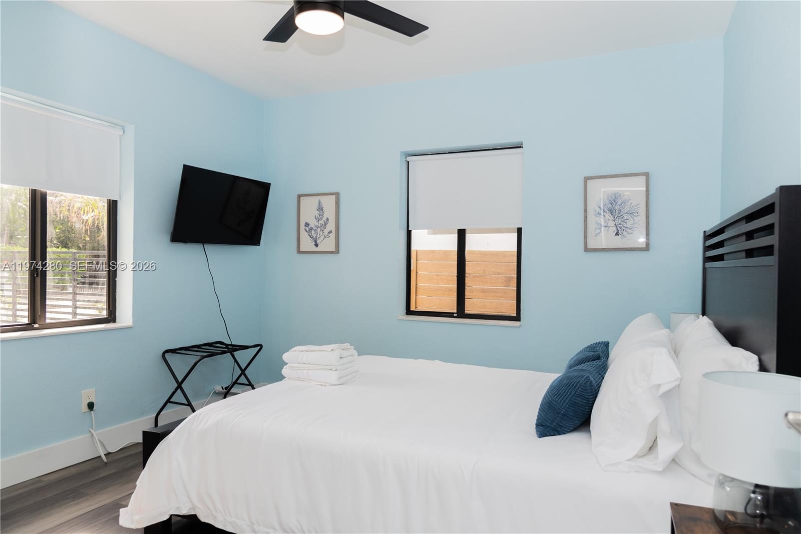 3134 Carter Street Miami, FL 33133 - Photo 29 of 36 a bedroom with a bed and a flat screen tv