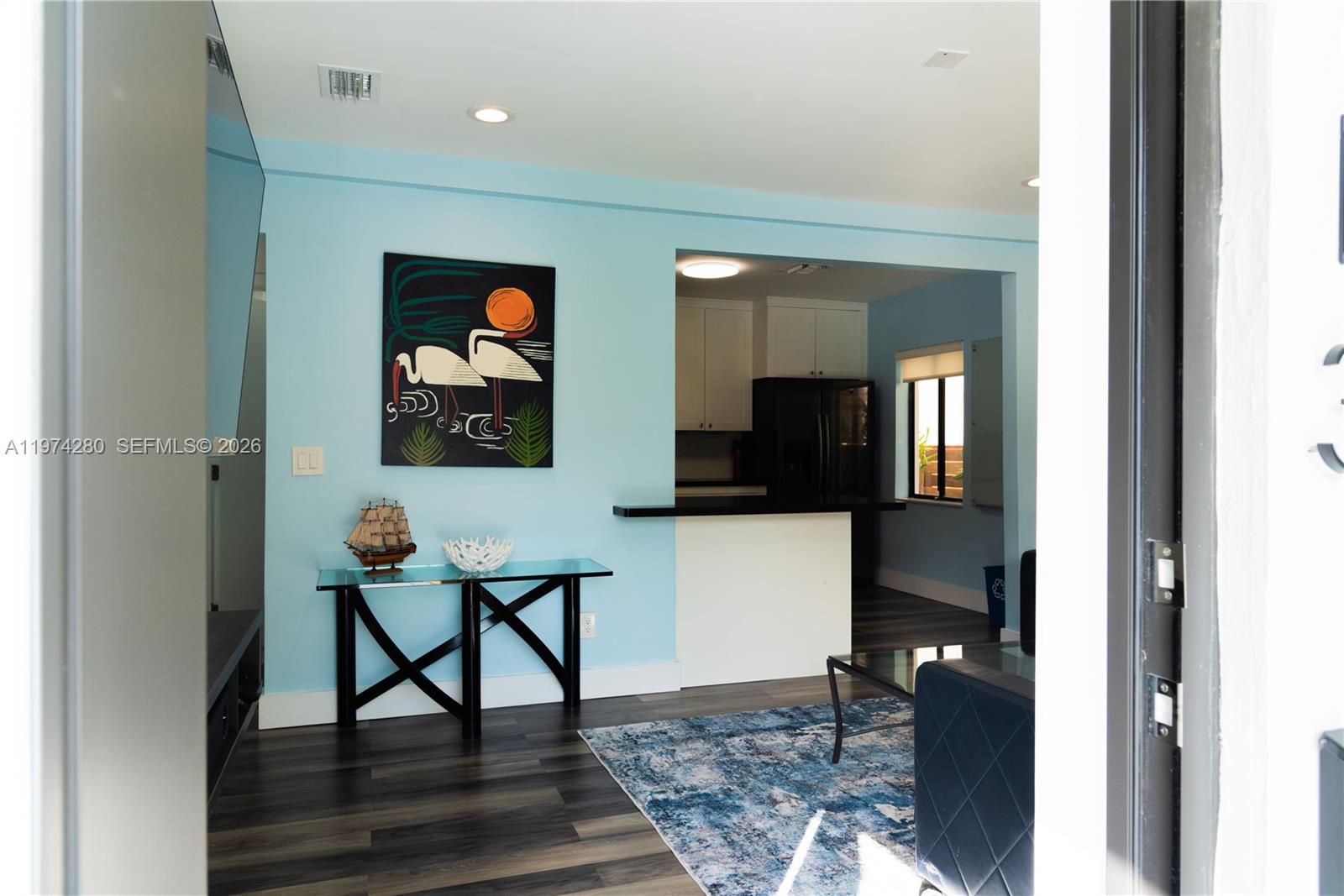 3134 Carter Street Miami, FL 33133 - Photo 32 of 36 a workspace with wooden floor and furniture