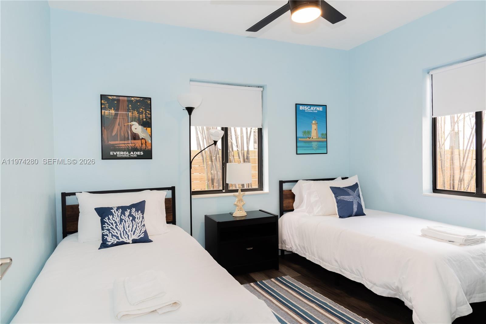3134 Carter Street Miami, FL 33133 - Photo 35 of 36 a bedroom with a bed and a chandelier