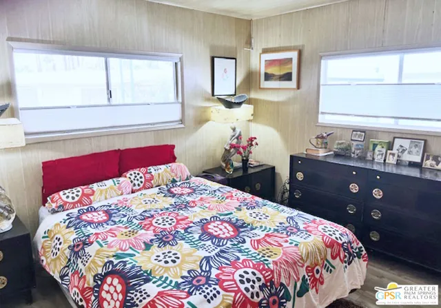 a bathroom with a sink vanity mirror and tub