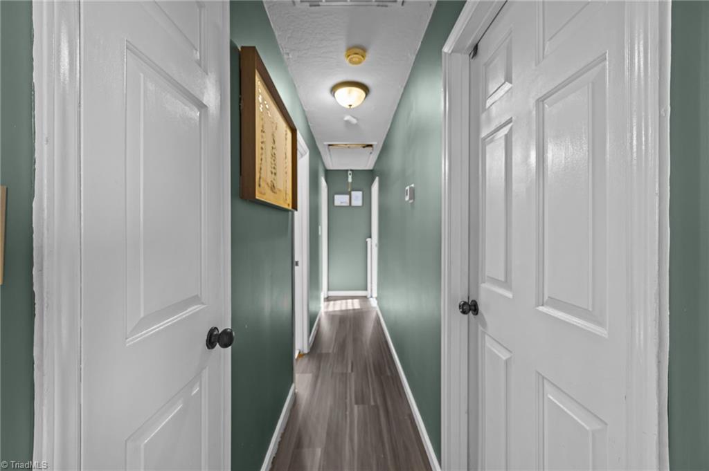 931 Ransom Road Winston-Salem, NC 27106 - Photo 20 of 48 Hallway to the bedrooms on the main floor.