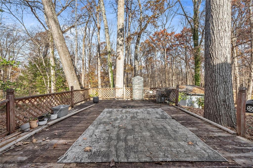 931 Ransom Road Winston-Salem, NC 27106 - Photo 32 of 48 Patio overlooking the mature trees on the backyard.