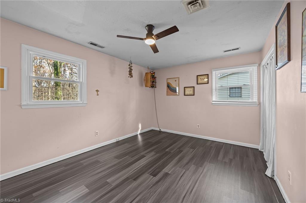 931 Ransom Road Winston-Salem, NC 27106 - Photo 4 of 48 Spacious primary bedroom on the main floor.