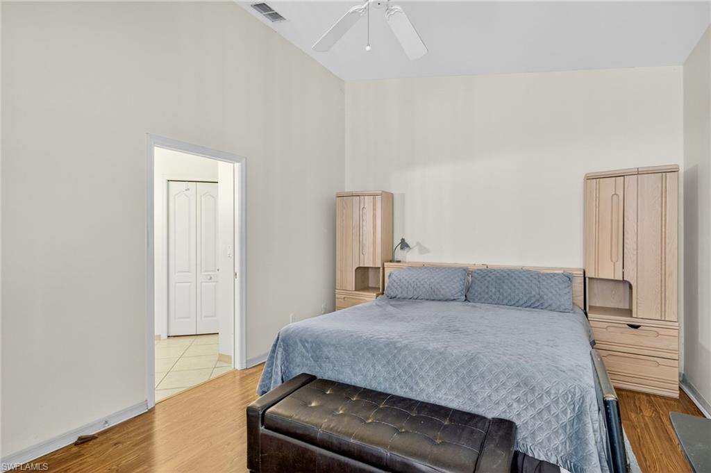 20818 Blacksmith Estero, FL 33928 - Photo 11 of 21 a bedroom with a bed and a dresser