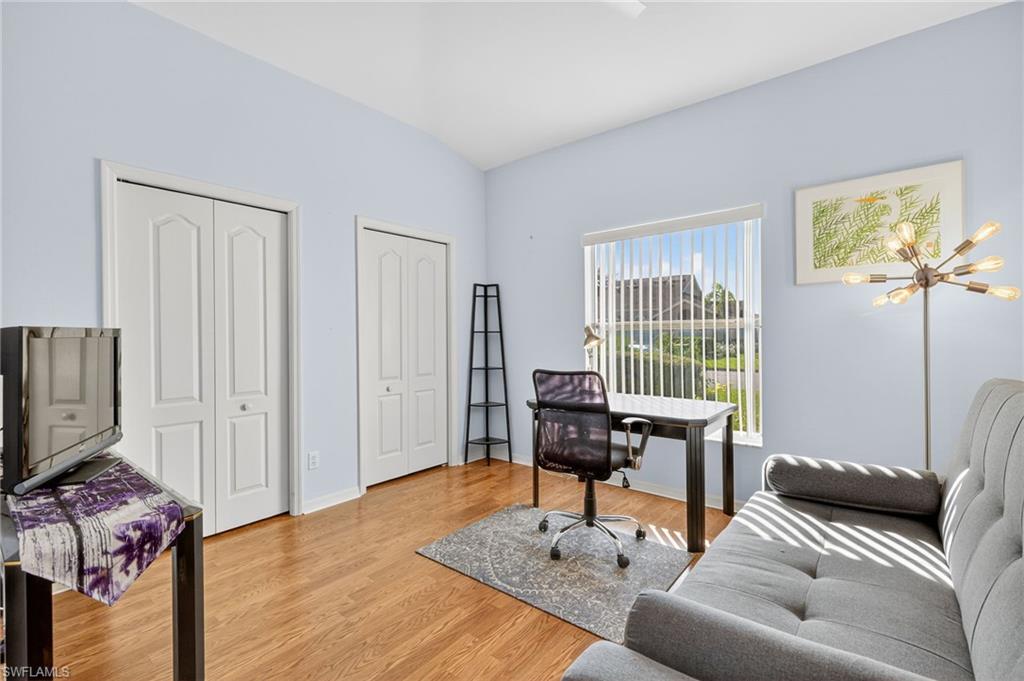 20818 Blacksmith Estero, FL 33928 - Photo 13 of 21 a living room with furniture and a flat screen tv