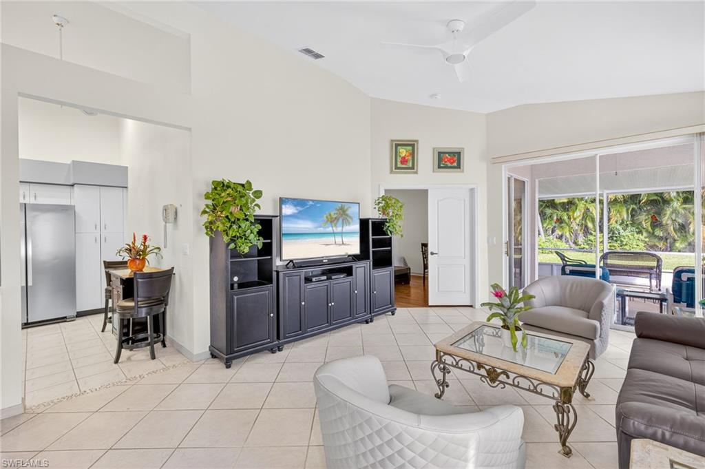 20818 Blacksmith Estero, FL 33928 - Photo 2 of 21 a living room with furniture and a flat screen tv