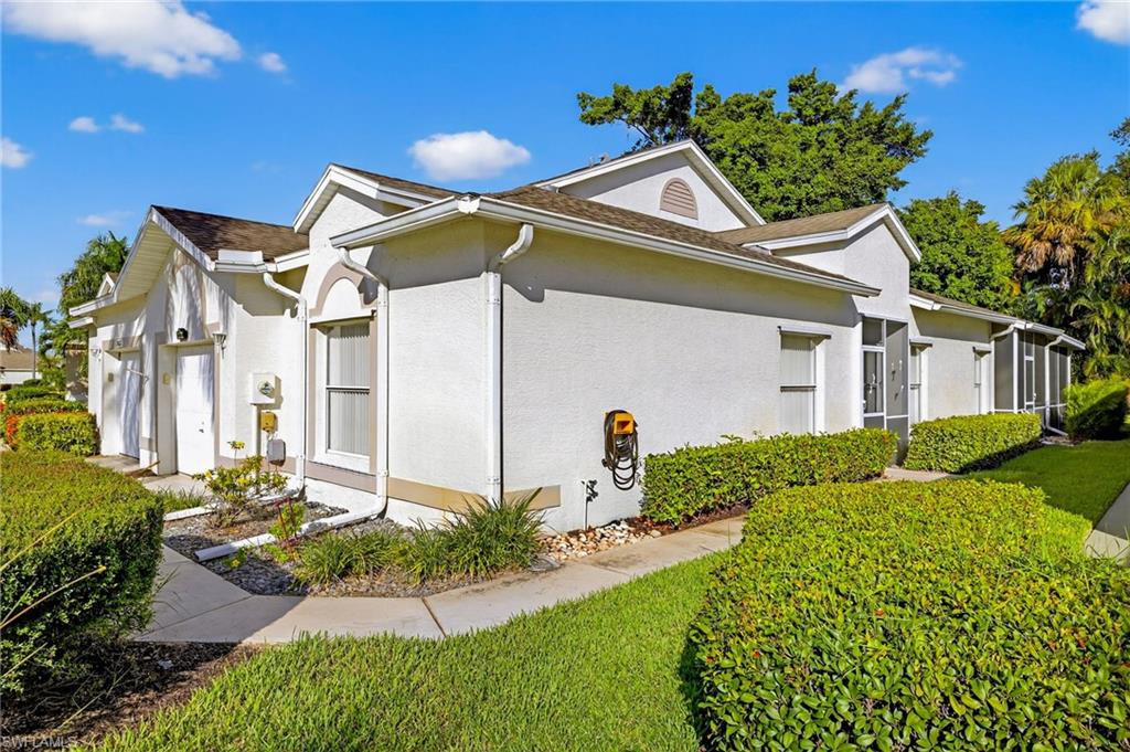 20818 Blacksmith Estero, FL 33928 - Photo 21 of 21 a front view of a house with a yard
