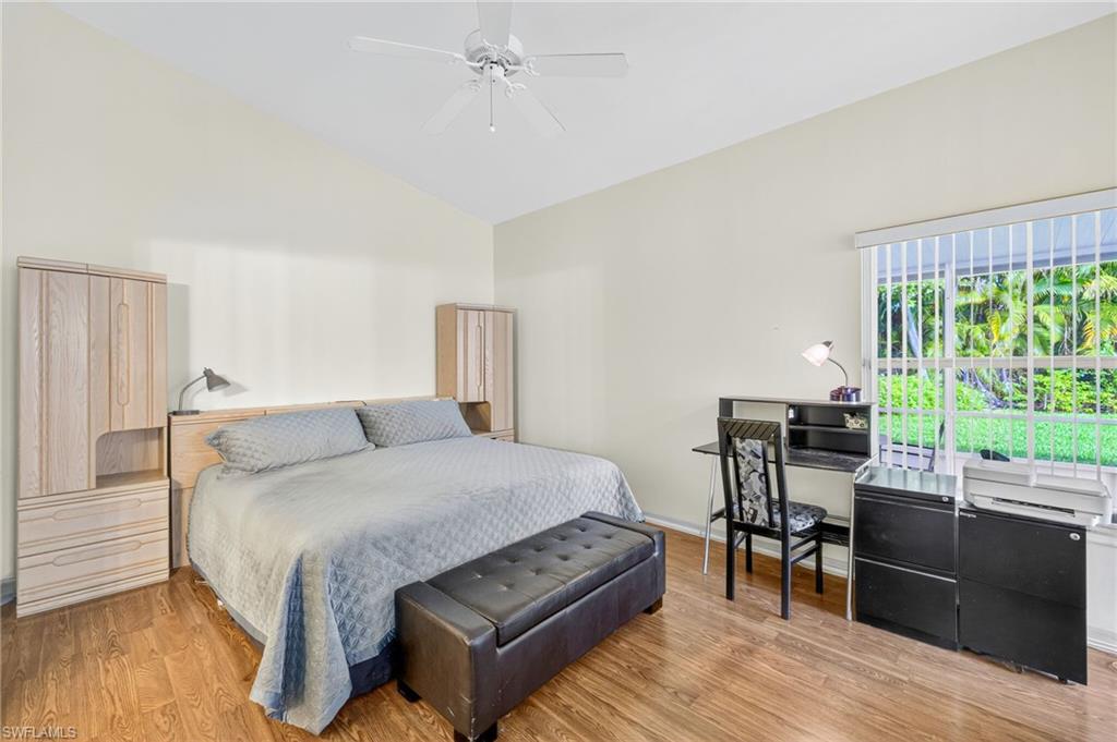 20818 Blacksmith Estero, FL 33928 - Photo 6 of 21 a bedroom with a bed and wooden floor