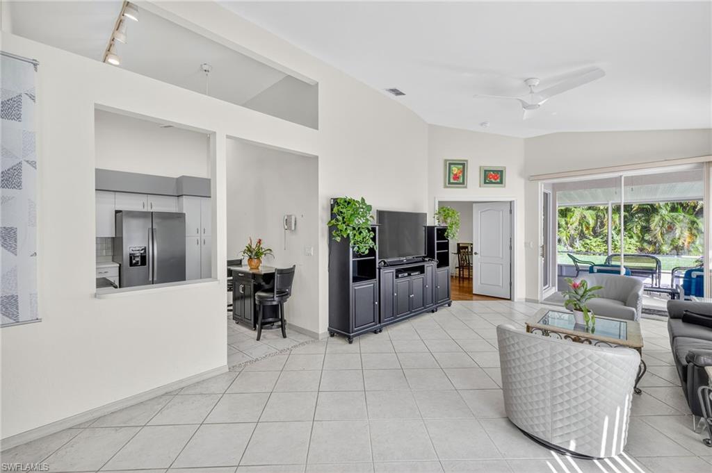 20818 Blacksmith Estero, FL 33928 - Photo 9 of 21 a living room with furniture and large windows