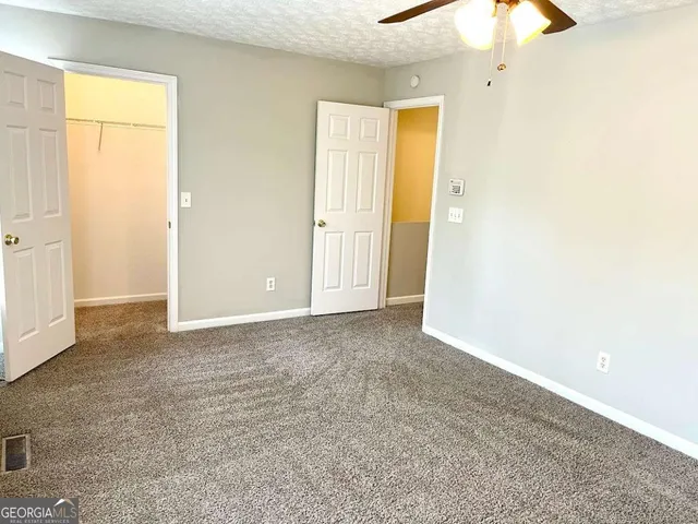 an empty room with a bathroom