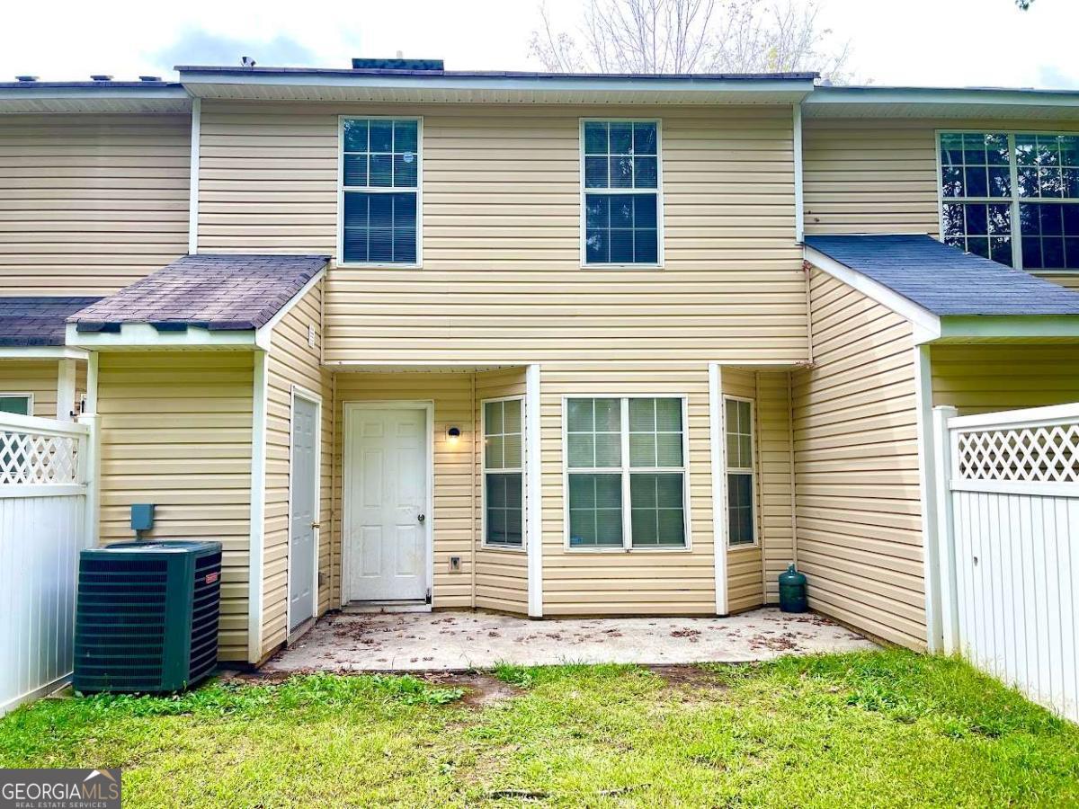 5594 Fair Creek Way Lithonia, GA 30038 - Photo 15 of 15 a view of a house with a yard and sitting area