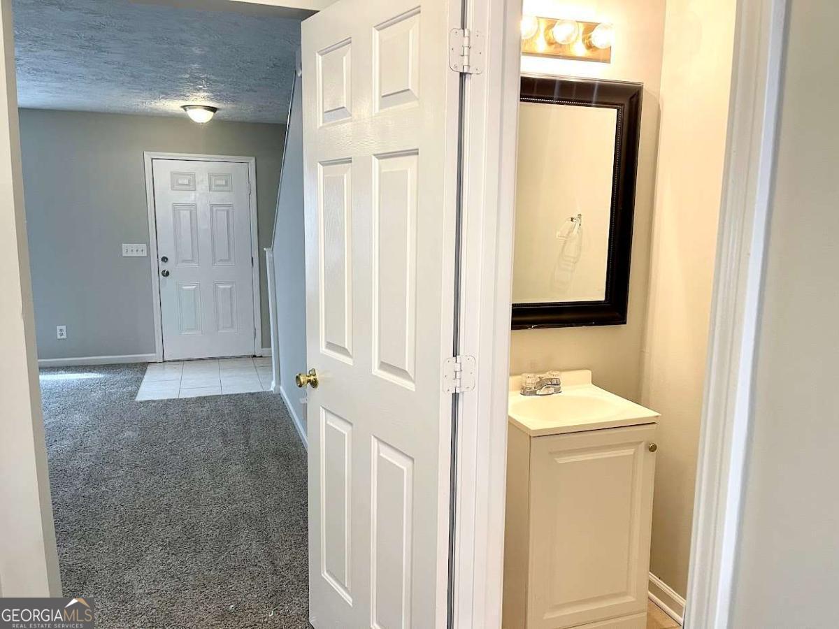 5594 Fair Creek Way Lithonia, GA 30038 - Photo 5 of 15 a view of a bathroom with utility room