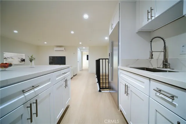 a open kitchen with stainless steel appliances sink refrigerator and stove