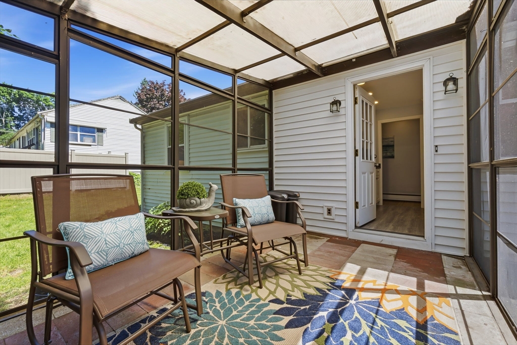 542 Trapelo Road Waltham, MA 02452 - Photo 37 of 40 a balcony with table and chairs