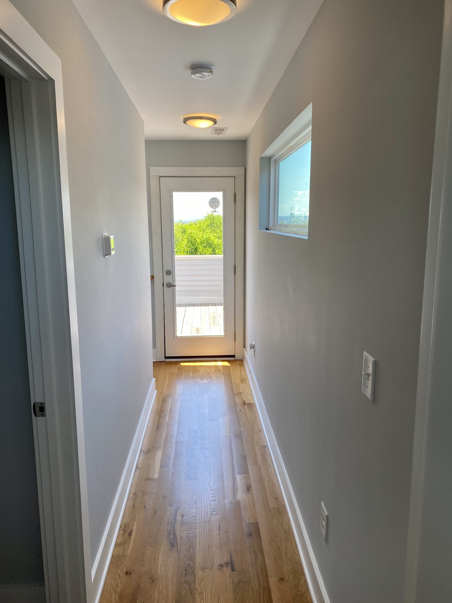 200 B Sunset Drive Nashville, TN 37207 - Photo 12 of 31 a view of a hallway with wooden floor and a bathroom