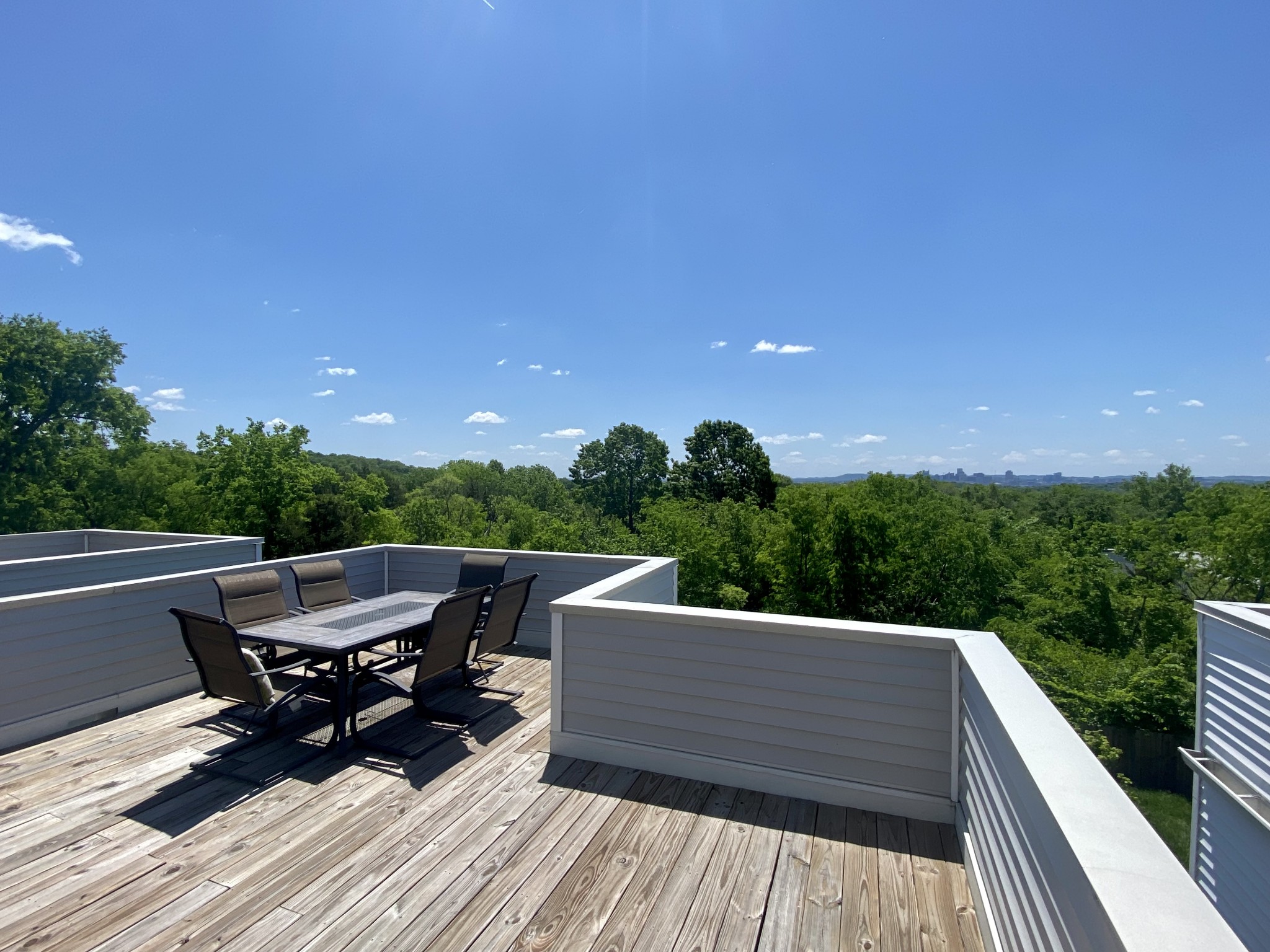 200 B Sunset Drive Nashville, TN 37207 - Photo 13 of 31 a view of a roof deck with table and chairs a barbeque with wooden floor and fence