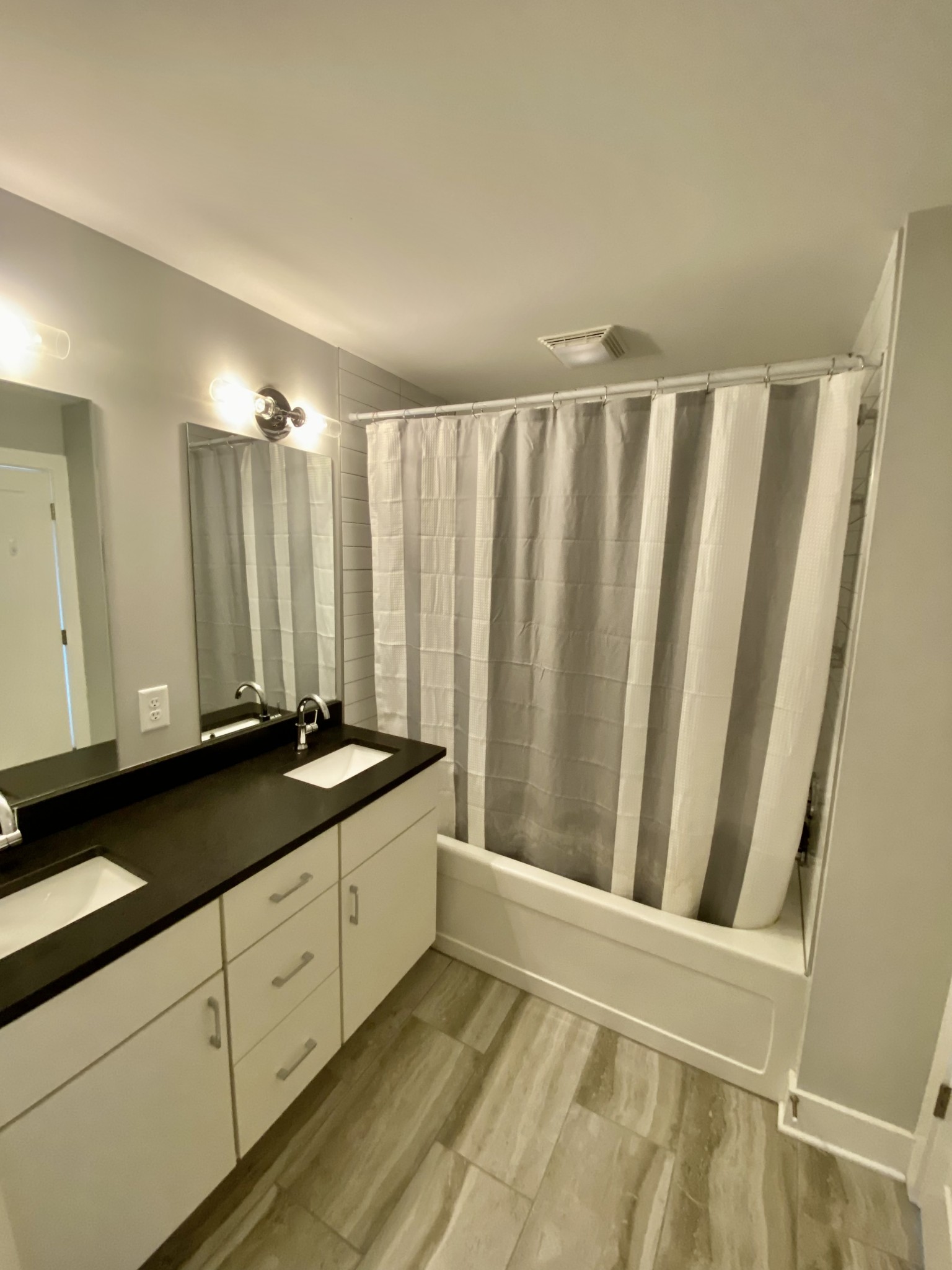 200 B Sunset Drive Nashville, TN 37207 - Photo 18 of 31 a bathroom with a granite countertop sink and a mirror