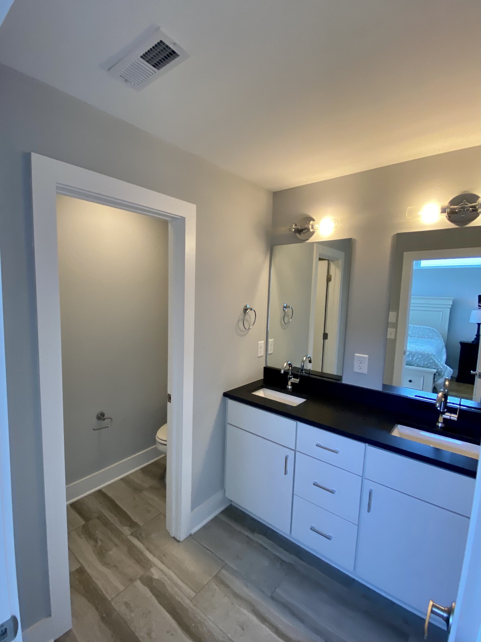 200 B Sunset Drive Nashville, TN 37207 - Photo 19 of 31 a spacious bathroom with a granite countertop sink and mirror