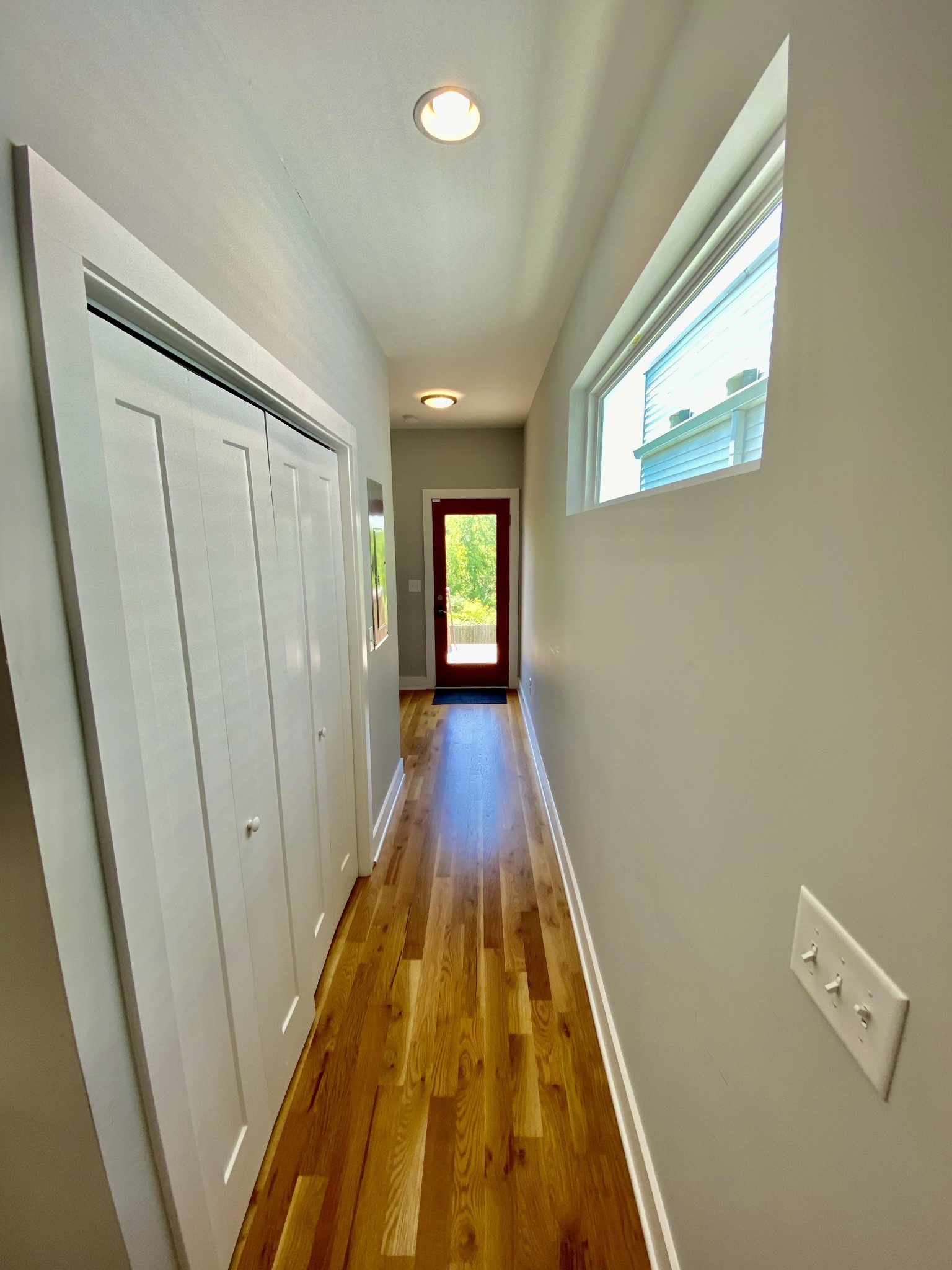 200 B Sunset Drive Nashville, TN 37207 - Photo 21 of 31 a view of a hallway with wooden floor and staircase