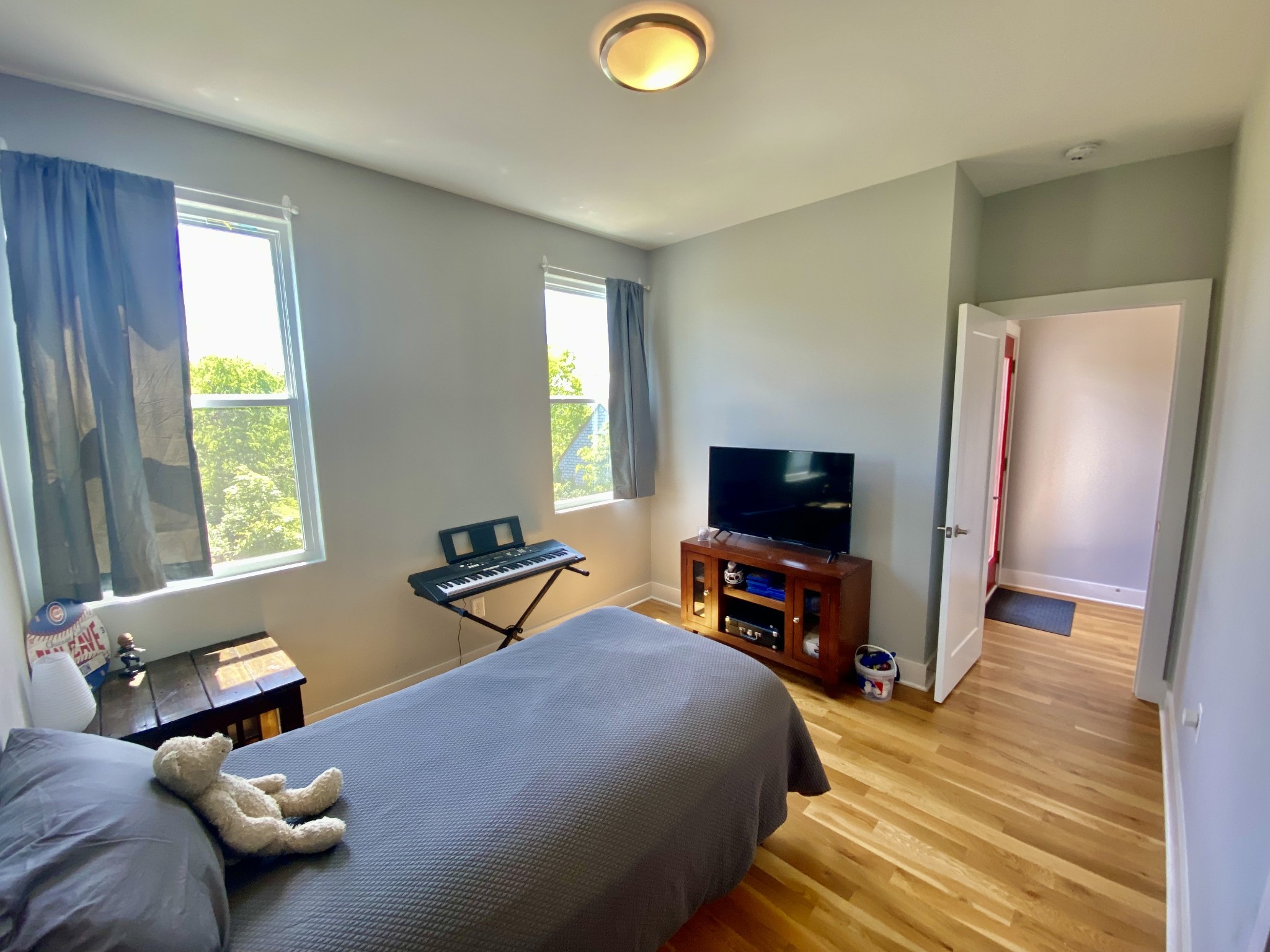 200 B Sunset Drive Nashville, TN 37207 - Photo 24 of 31 a bedroom with furniture and a flat screen tv