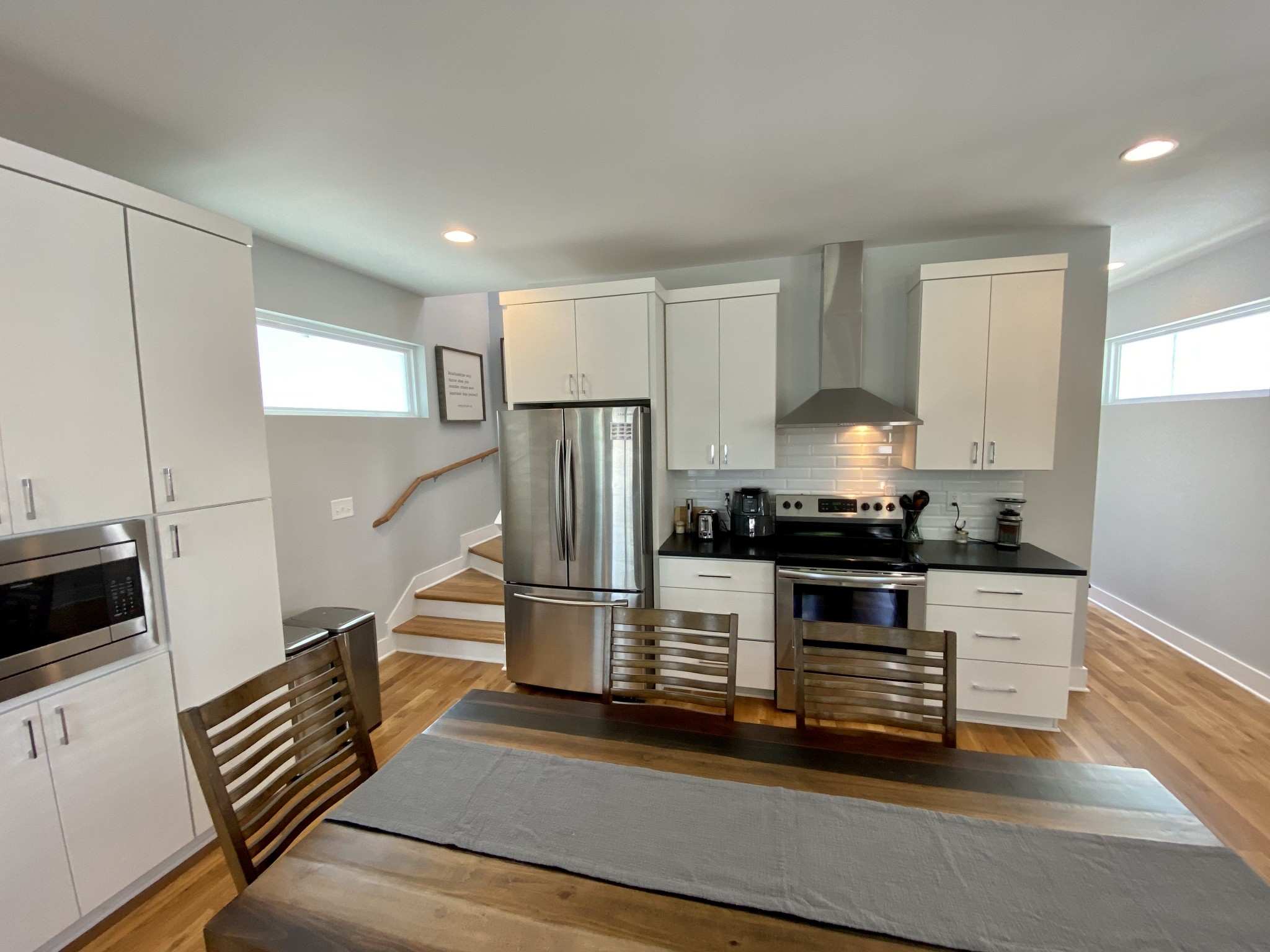 200 B Sunset Drive Nashville, TN 37207 - Photo 10 of 31 a kitchen with kitchen island granite countertop a stove and a refrigerator
