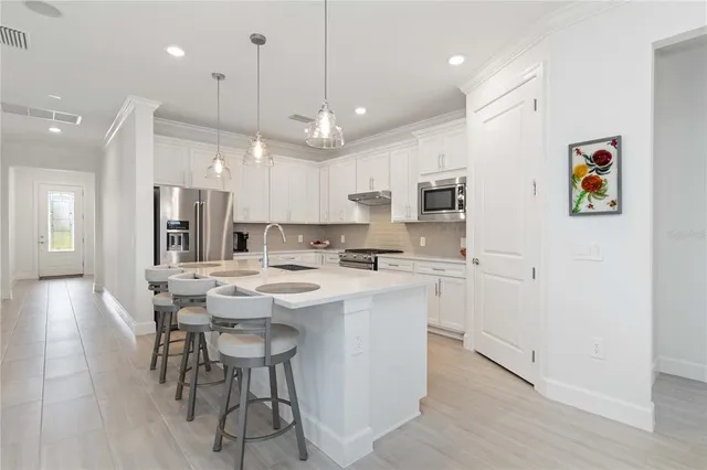 a bathroom with double vanity sink and a mirror