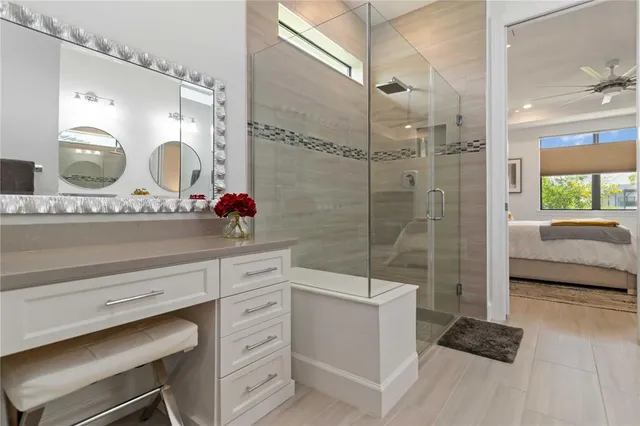 a bedroom with a bed and painting on the wall