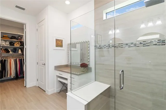 a view of a workspace with furniture and a couch