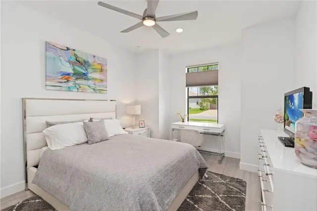 a dining room with furniture and a floor to ceiling window