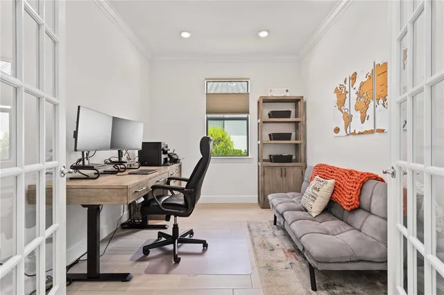 a view of a house with swimming pool and sitting area