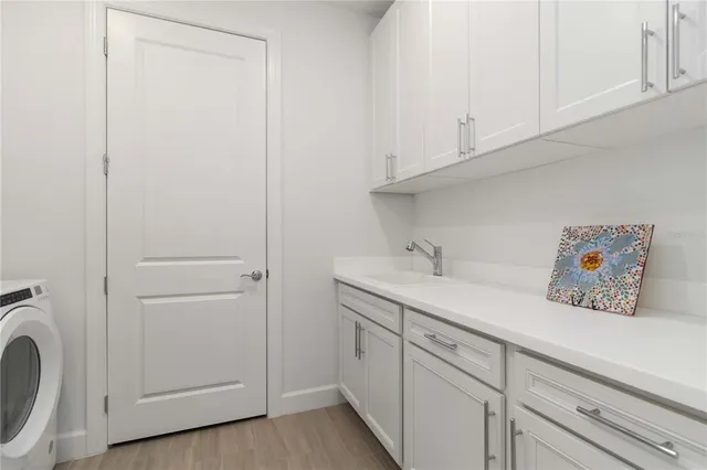 a view of swimming pool with outdoor seating and lake view