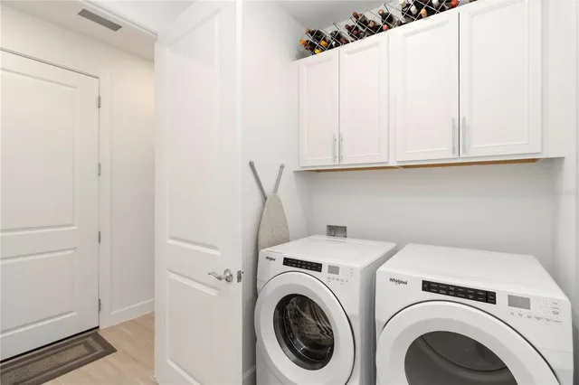 a view of a swimming pool with a slide and potted plants