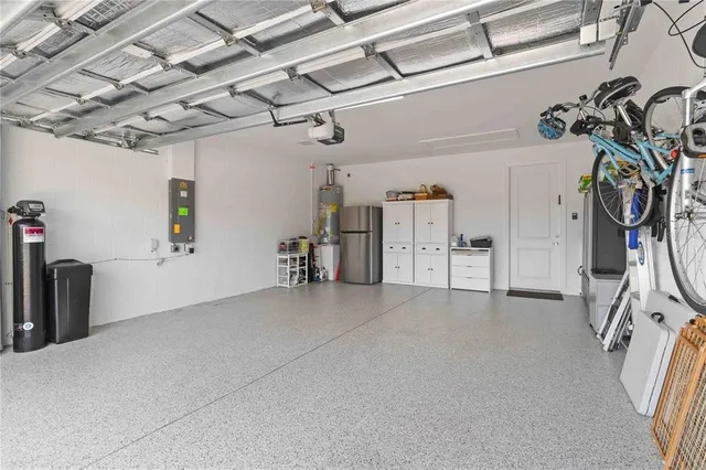 a living room with furniture a dining table and a flat screen tv