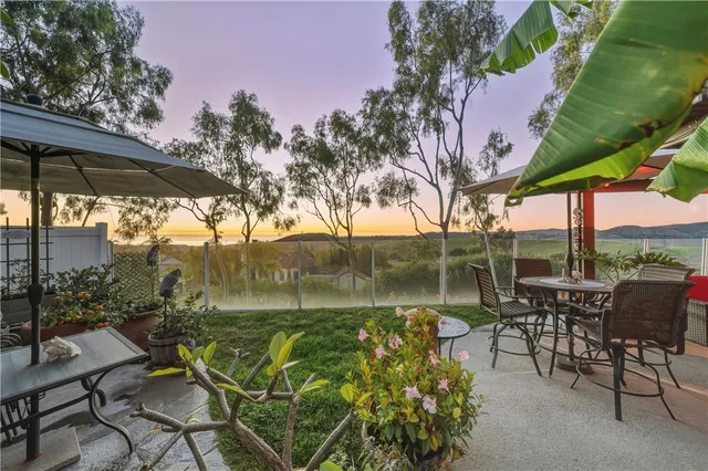 a view of a chairs and table in the patio