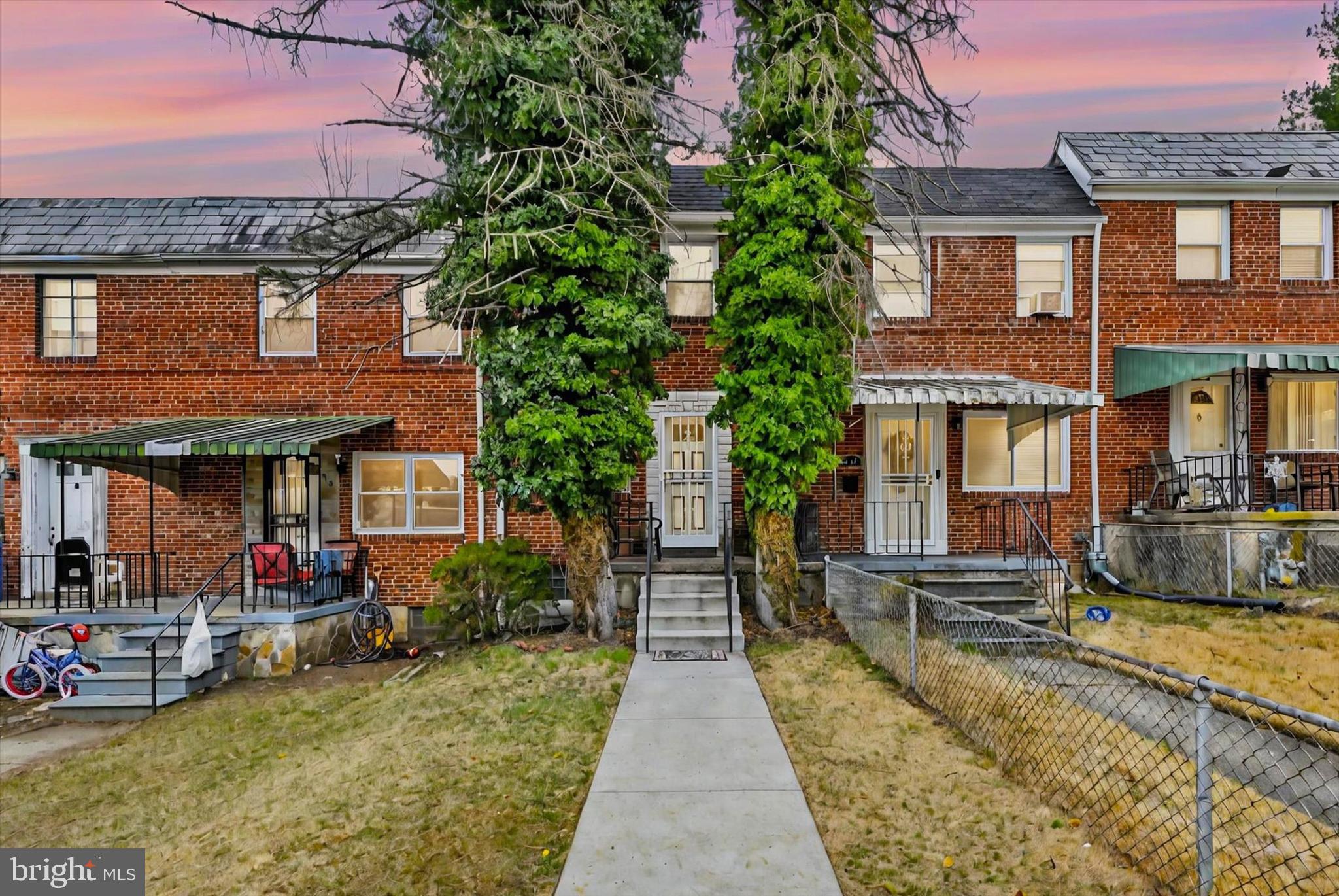 a view of a brick building with many windows